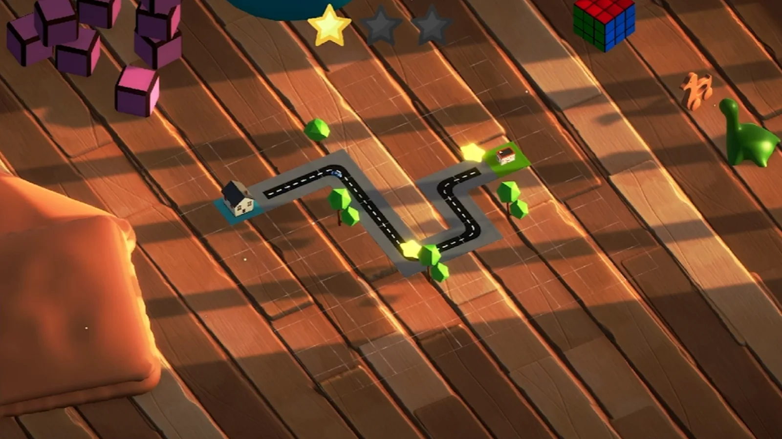 A winding road drawn between toys on a bedroom floor