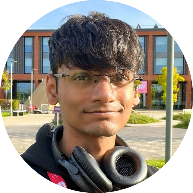 Sarthak Sachdeva outdoors, wearing glasses and headphones